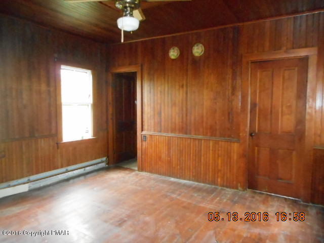 233 Perkins Pond Road Beach Lake, PA 18405 - Photo 3 of 20 a view of an empty room with a window