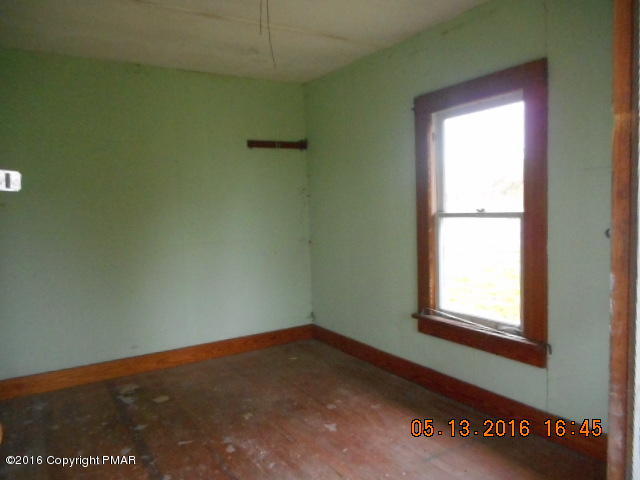 233 Perkins Pond Road Beach Lake, PA 18405 - Photo 7 of 20 an empty room with a window