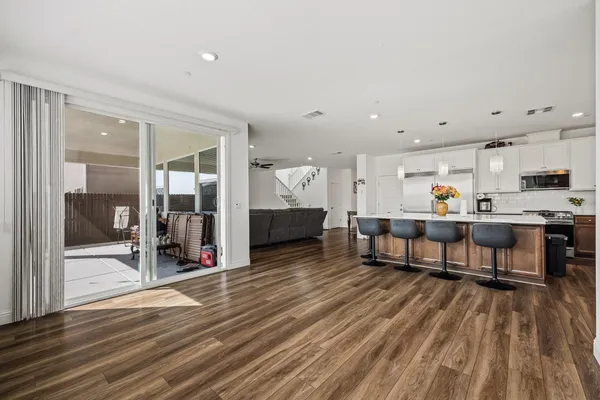 a living room with furniture and a table