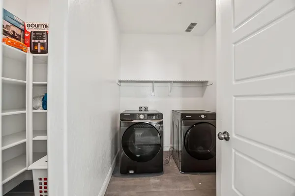a utility room with dryer and washer