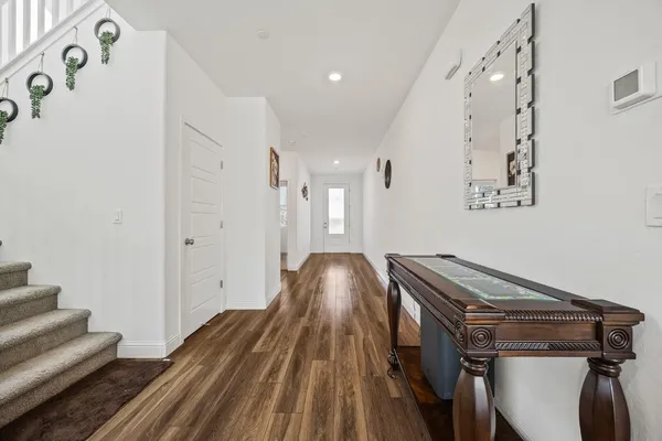 a view of a hallway with staircase