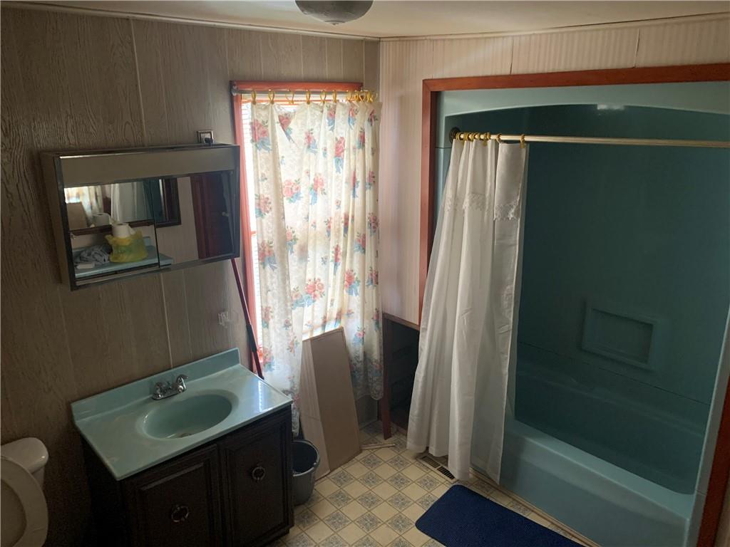 232 Wendel Road Irwin, PA 15642 - Photo 12 of 20 a bathroom with a sink toilet and shower