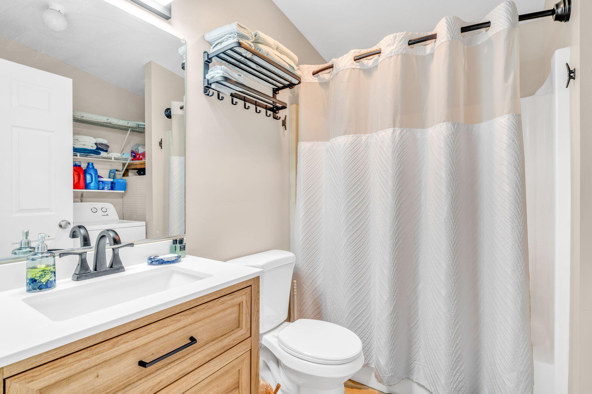 57485 Gibson Street Marathon, FL 33050 - Photo 25 of 33 a bathroom with a sink a toilet and shower curtain