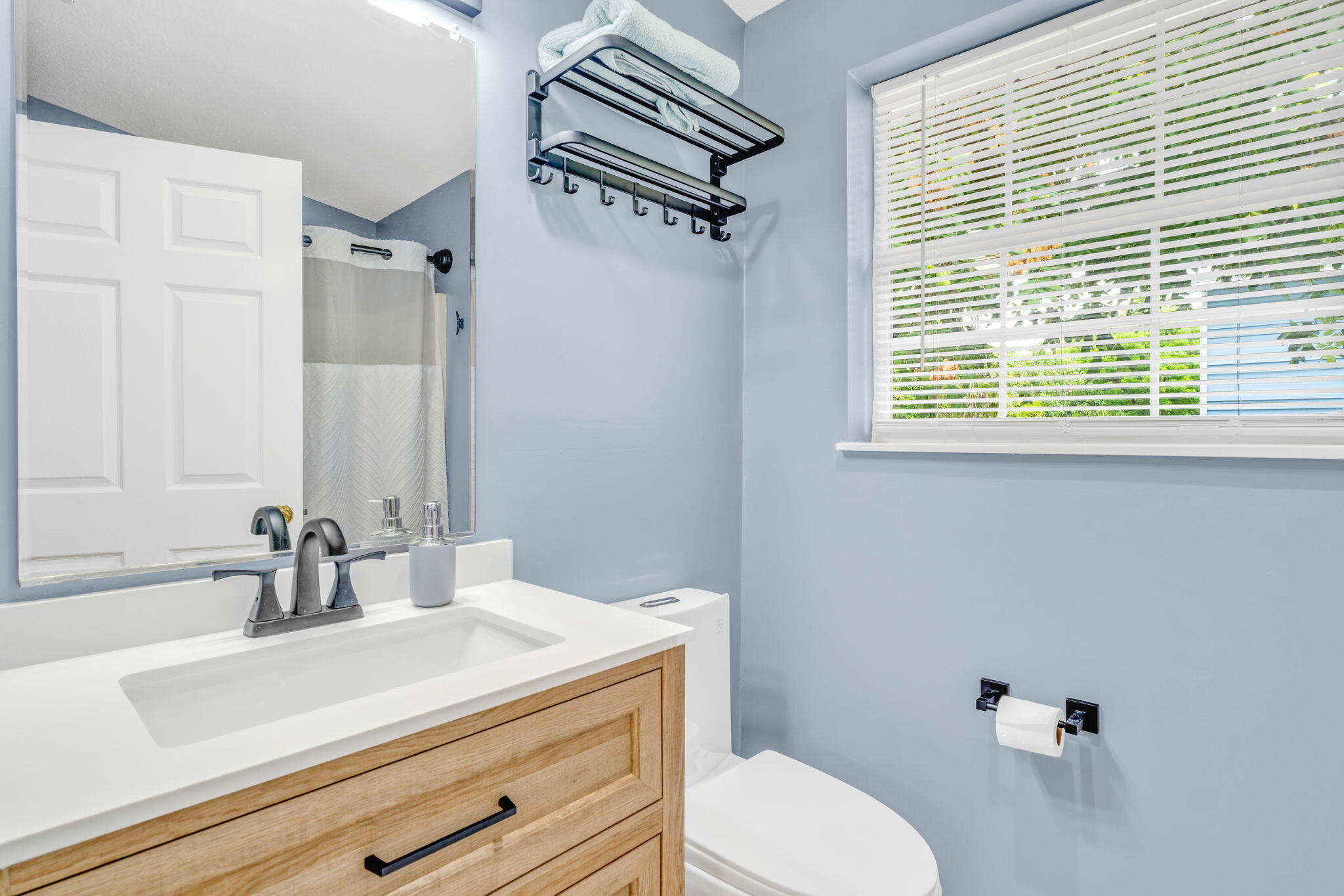 57485 Gibson Street Marathon, FL 33050 - Photo 30 of 33 a bathroom with a sink a toilet and shower