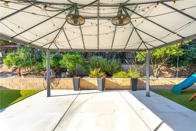 a view of yard with a patio