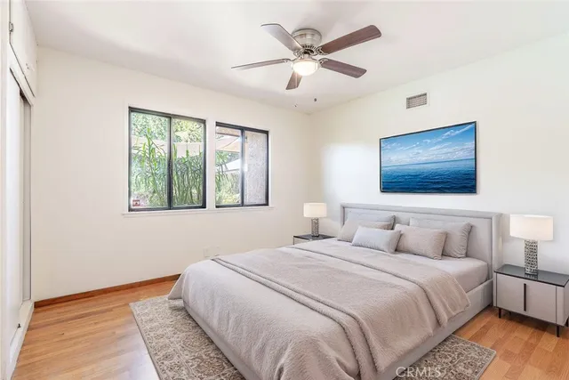 a bedroom with a large bed and a window