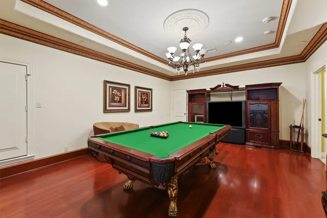 a view of a kitchen with wooden floor and a sink