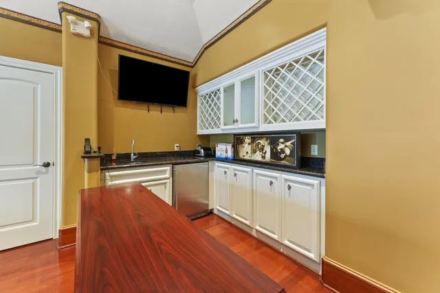 a bathroom with a sink a mirror and a shower