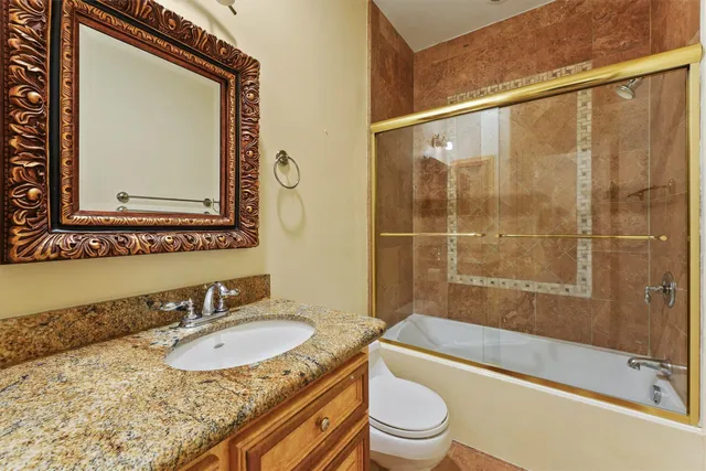 a view of a patio with couches chairs and wooden floor