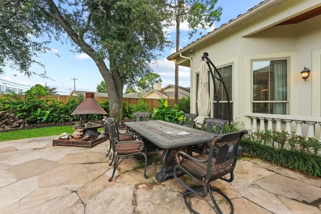 a view of a park with trees and flowers