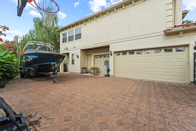 an aerial view of a house with yard swimming pool and outdoor seating