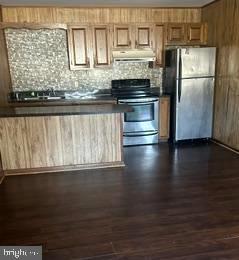 21628 Great Mills Road, Unit A2 Lexington Park, MD 20653 - Photo 6 of 11 a kitchen with granite countertop a stove and a refrigerator