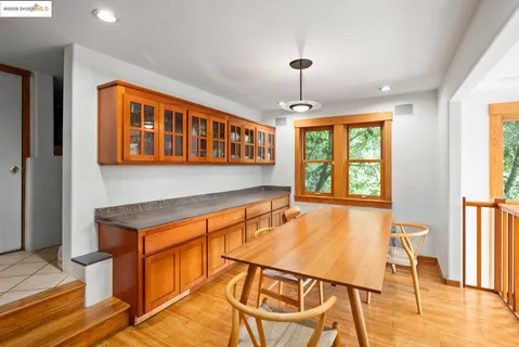a dining room with furniture and window