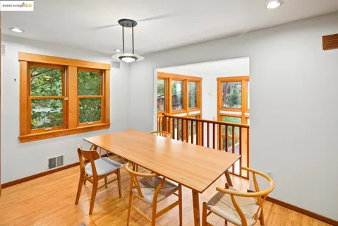 a view of a dining room with furniture window and outside view
