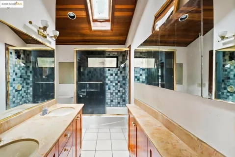 a view of a road with a tree in the background