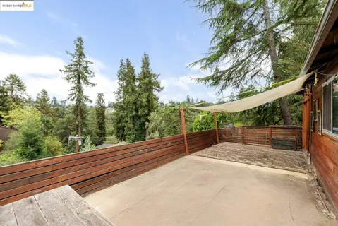 a view of a two chairs in the balcony