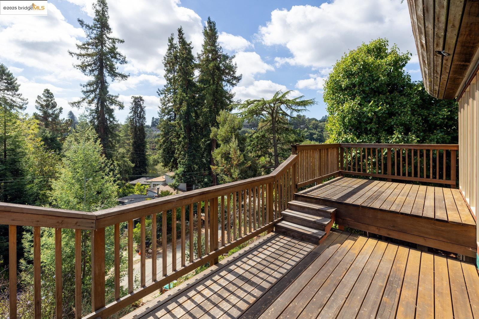 5663 Florence Terrace Oakland, CA 94611 - Photo 39 of 56 a view of balcony with wooden floor and fence