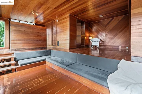 a view of walk in closet with wooden floor
