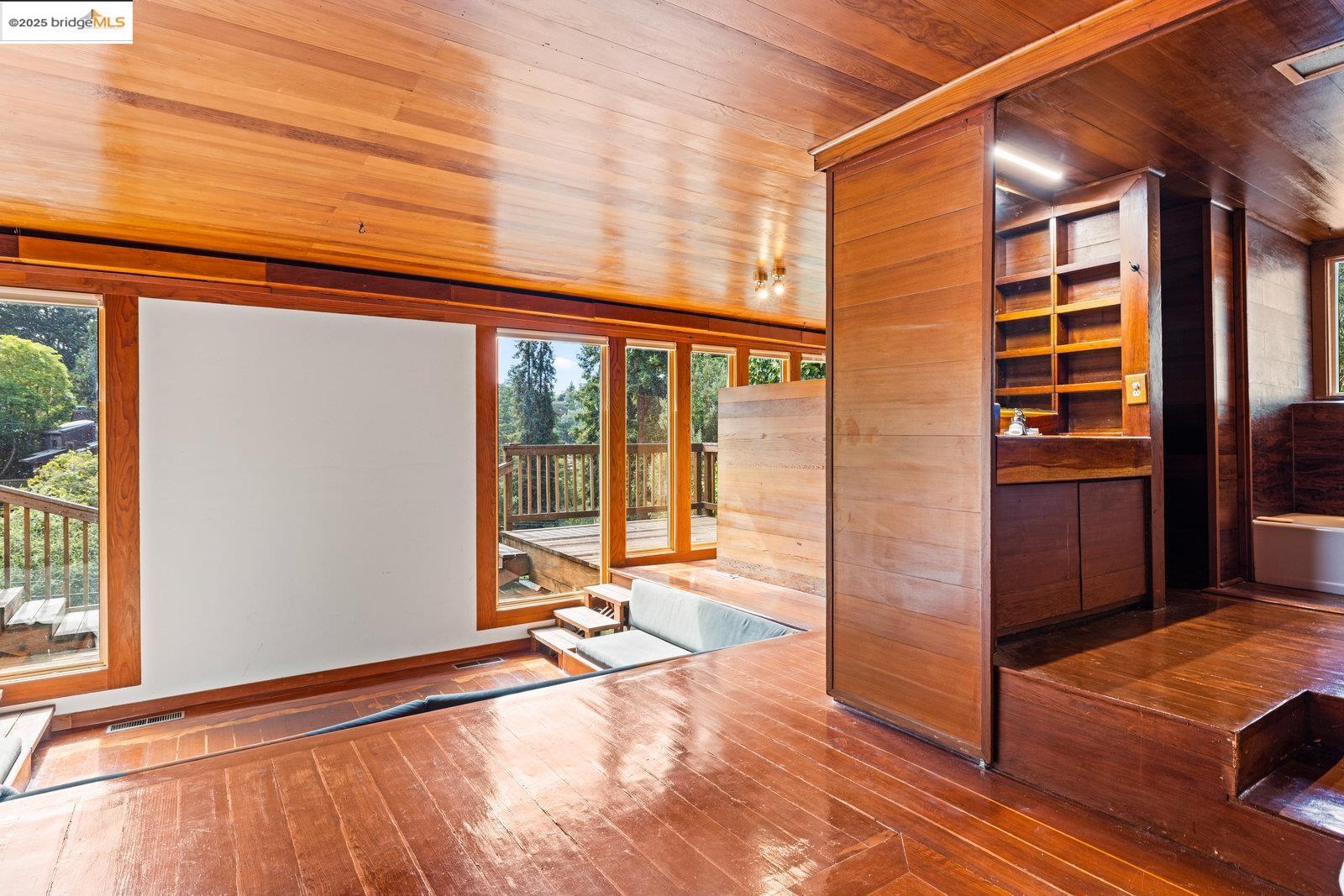 5663 Florence Terrace Oakland, CA 94611 - Photo 47 of 56 a view of balcony with floor to ceiling window and wooden floor