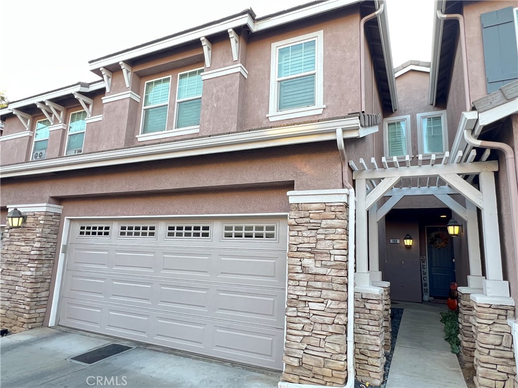 a front view of a house with garage