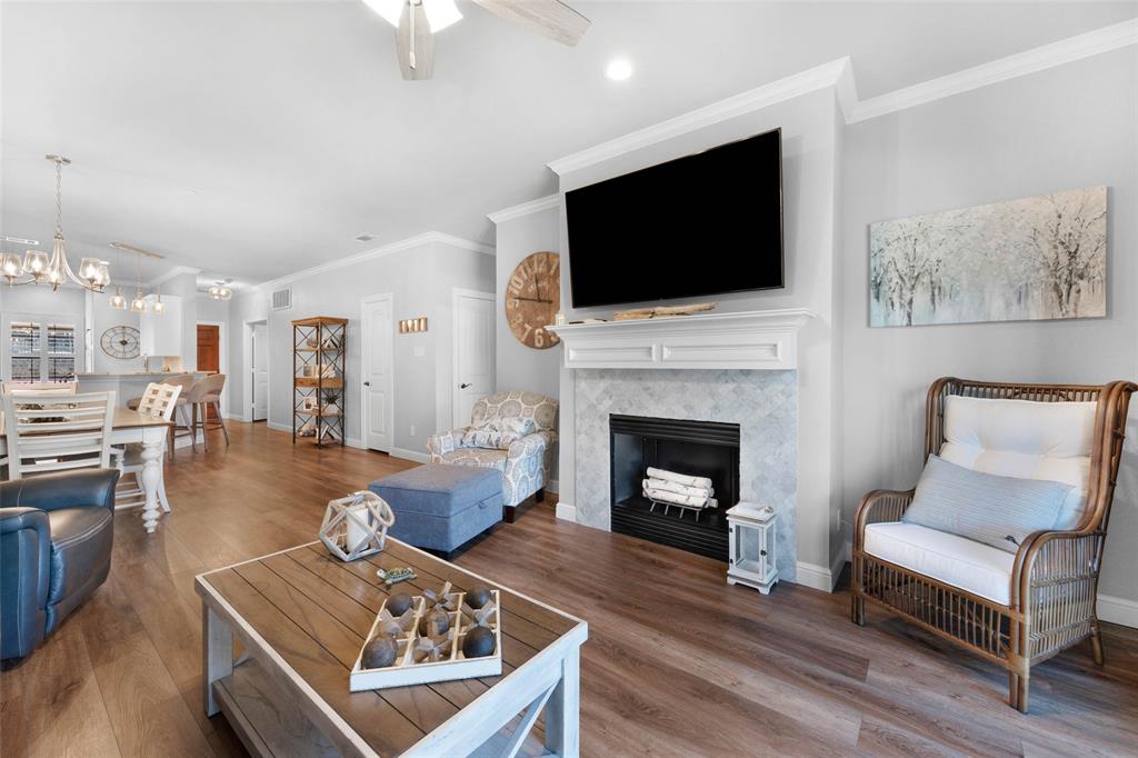 a living room with furniture fireplace and flat screen tv