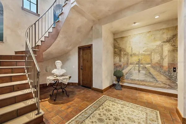 a kitchen with stove and cabinets