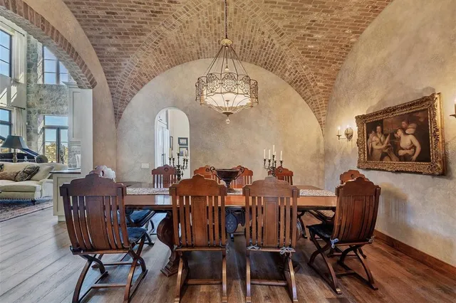 a view of a white house with a yard