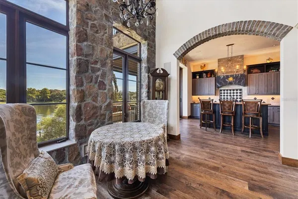 a bathroom with a sink and mirror with toilet