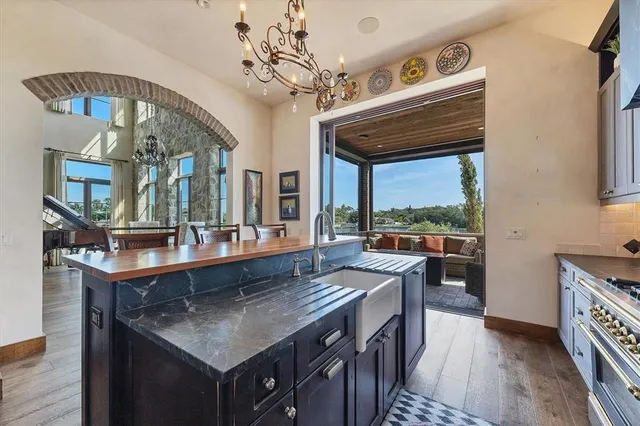 a view of a house with swimming pool and sitting area