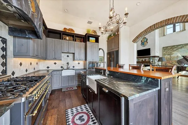 a bathroom with a double vanity sink a mirror and a shower