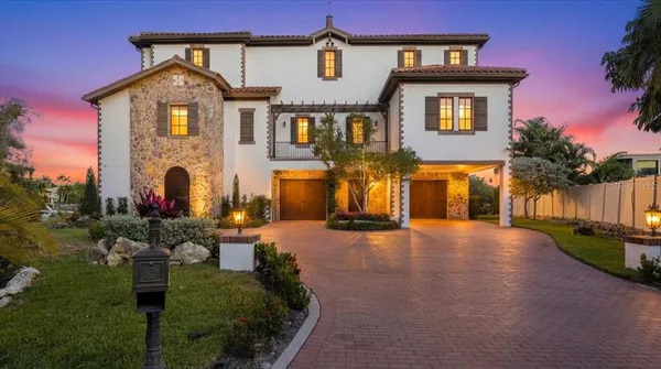 a view of a swimming pool with an outdoor seating