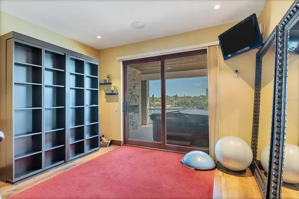 a view of a house with swimming pool and sitting area