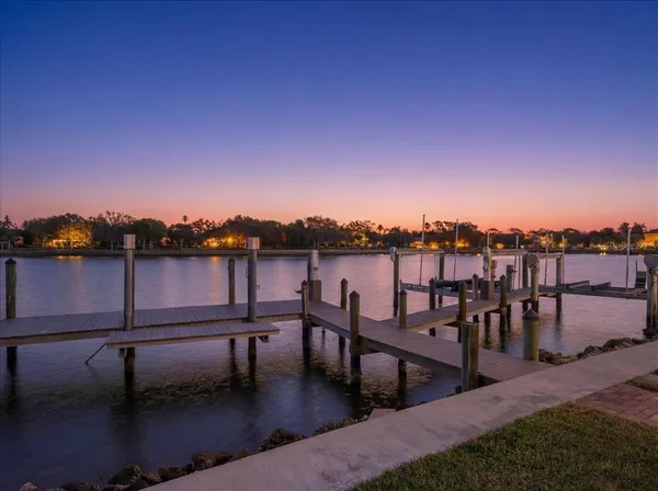 a view of a swimming pool with front of house