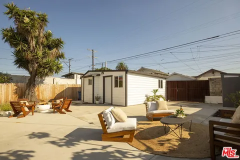 a living room with patio furniture