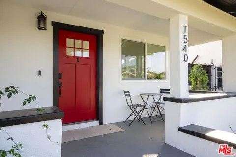 a view of a dining room with furniture and window