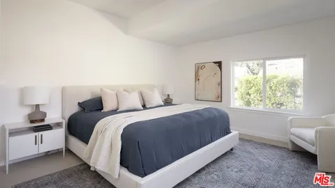 a bed room with a bed and a couch