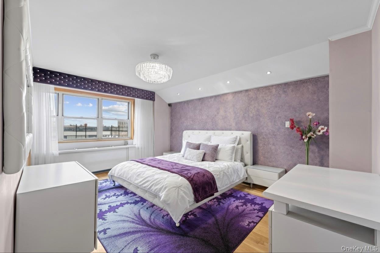 102-10 66th Road, Unit 3B Queens, NY 11375 - Photo 4 of 26 a bedroom with a large bed and a potted plant