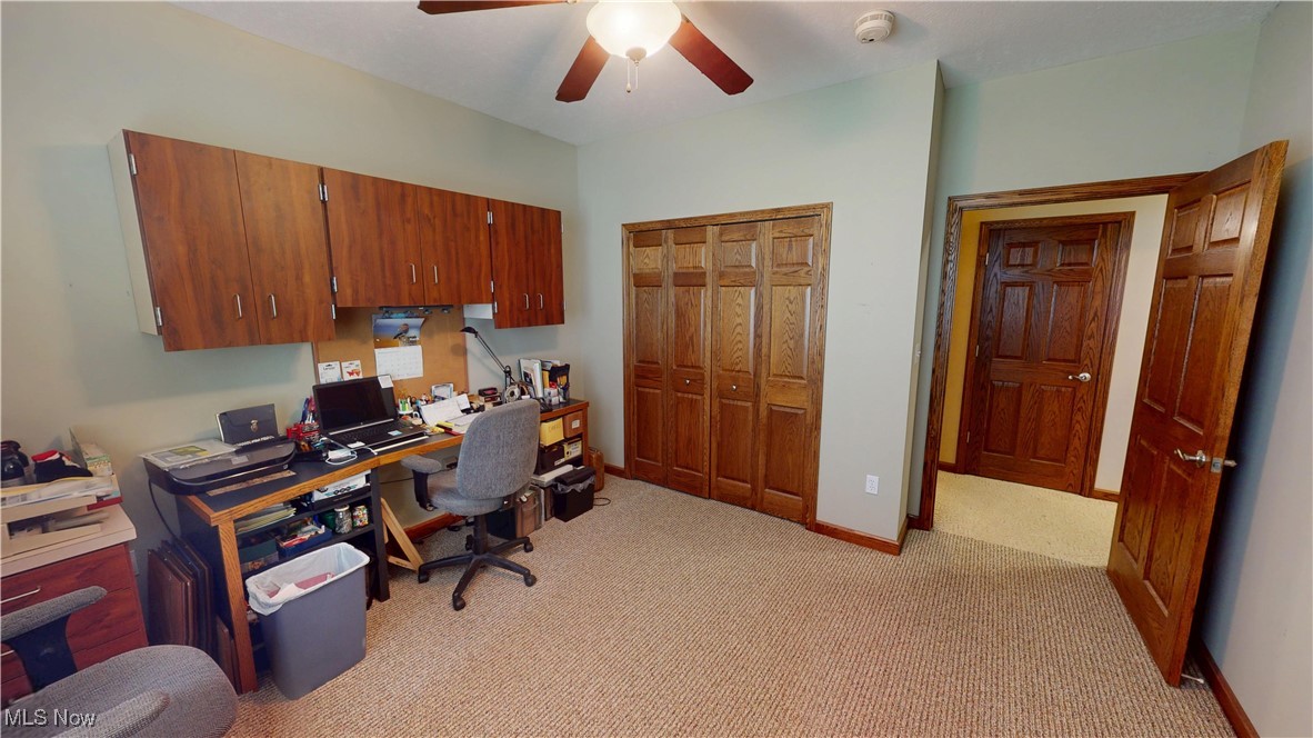 10323 Smith Road Litchfield, OH 44253 - Photo 26 of 50 Office with light carpet, baseboards, and ceiling fan