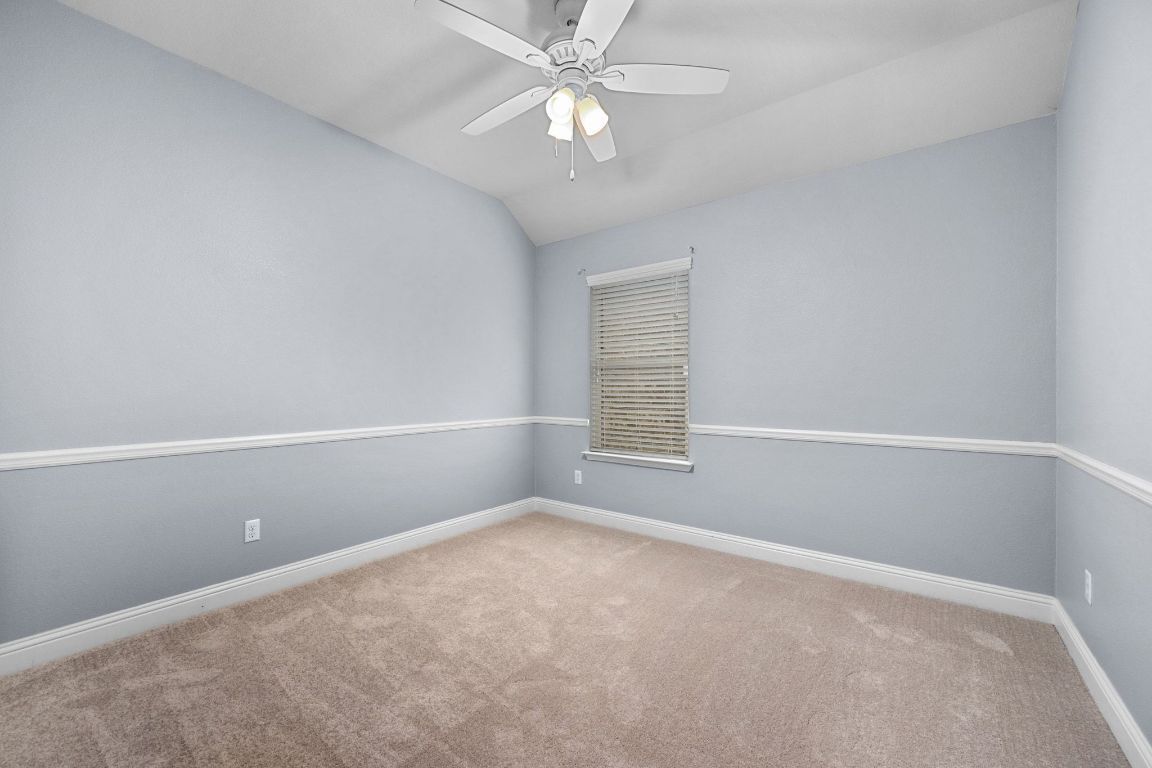 2041 Elaina Loop Leander, TX 78641 - Photo 20 of 25 With a smart split layout, two rooms are set apart from the rest of the home, ideal for guests, teens, or a quiet workspace.
