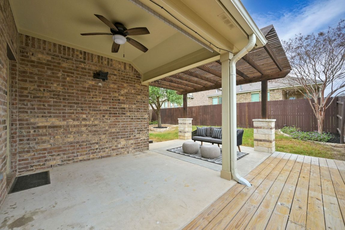 2041 Elaina Loop Leander, TX 78641 - Photo 22 of 25 An additional side deck was added to provide even more space to extend you your living area, add a BBQ grill, or both!