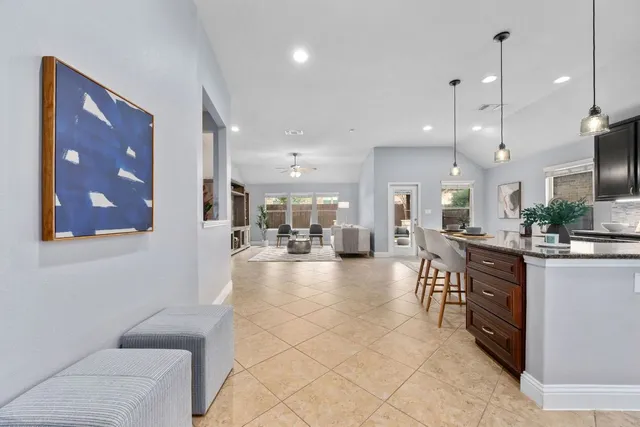 a lobby with furniture and a large mirror