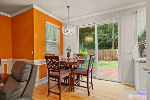 a view of a dining room with furniture window and outside view