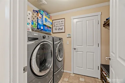 a view of a hallway with washer and dryer