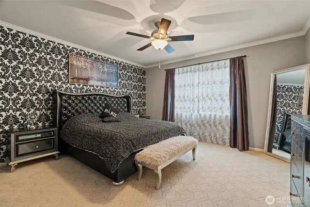a bedroom with a bed and a chandelier