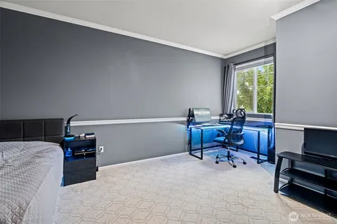 a reading room with furniture and a window