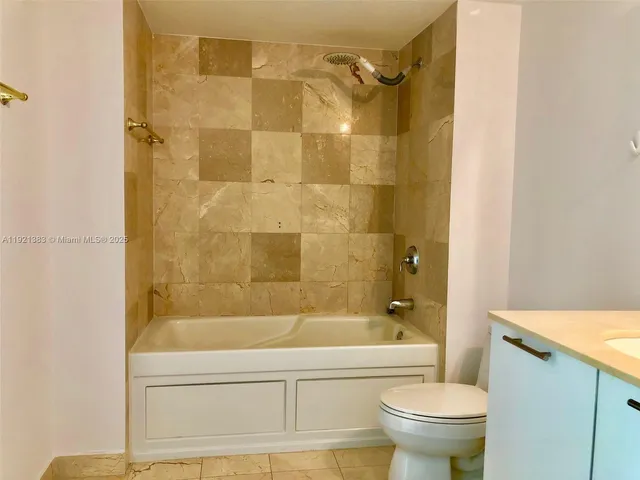 a bathroom with a shower and a toilet