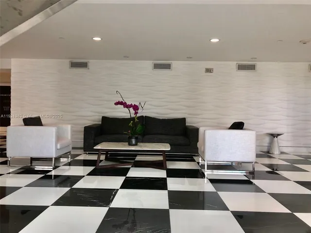 a living room with a black white checkered floor with a black white checkered floor