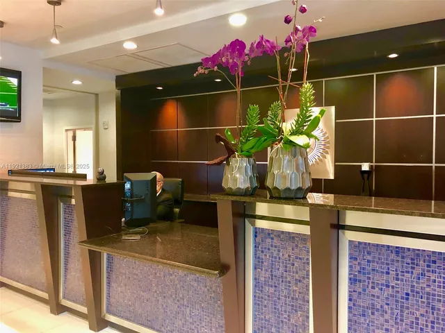 a view of livingroom with furniture and windows