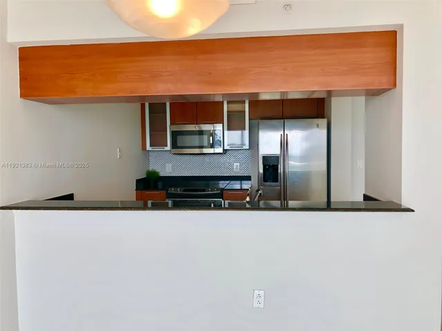 a view of a refrigerator in the house