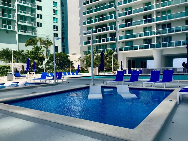 a view of pool with outdoor seating
